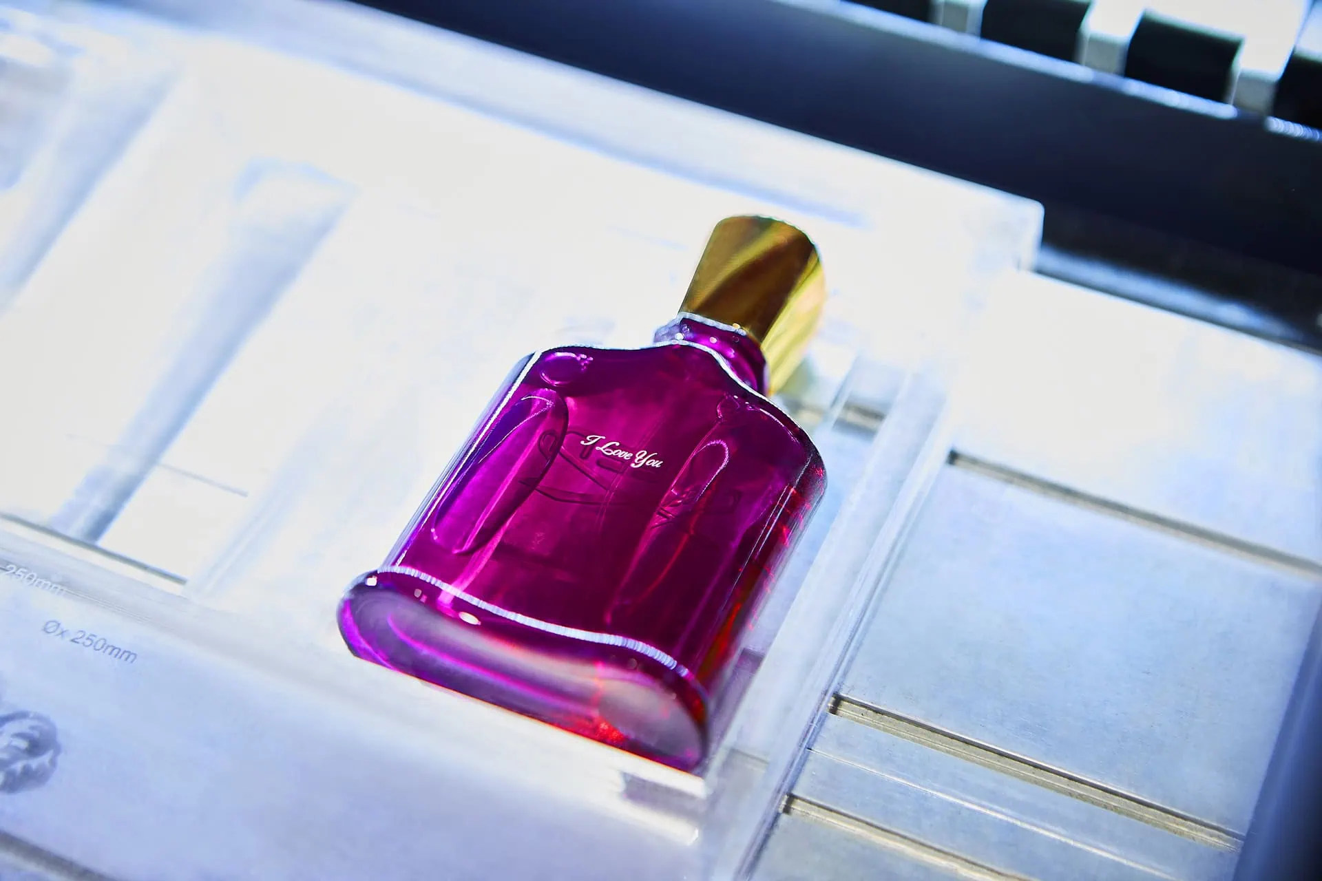 Creed fragrance being laser personalised