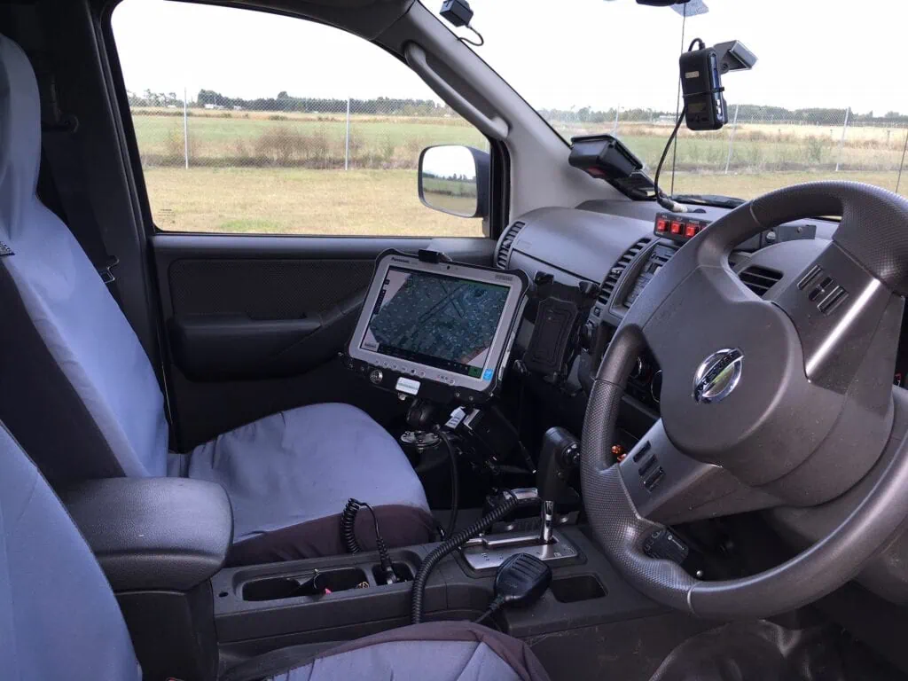 Inside of a car with tablet and radios